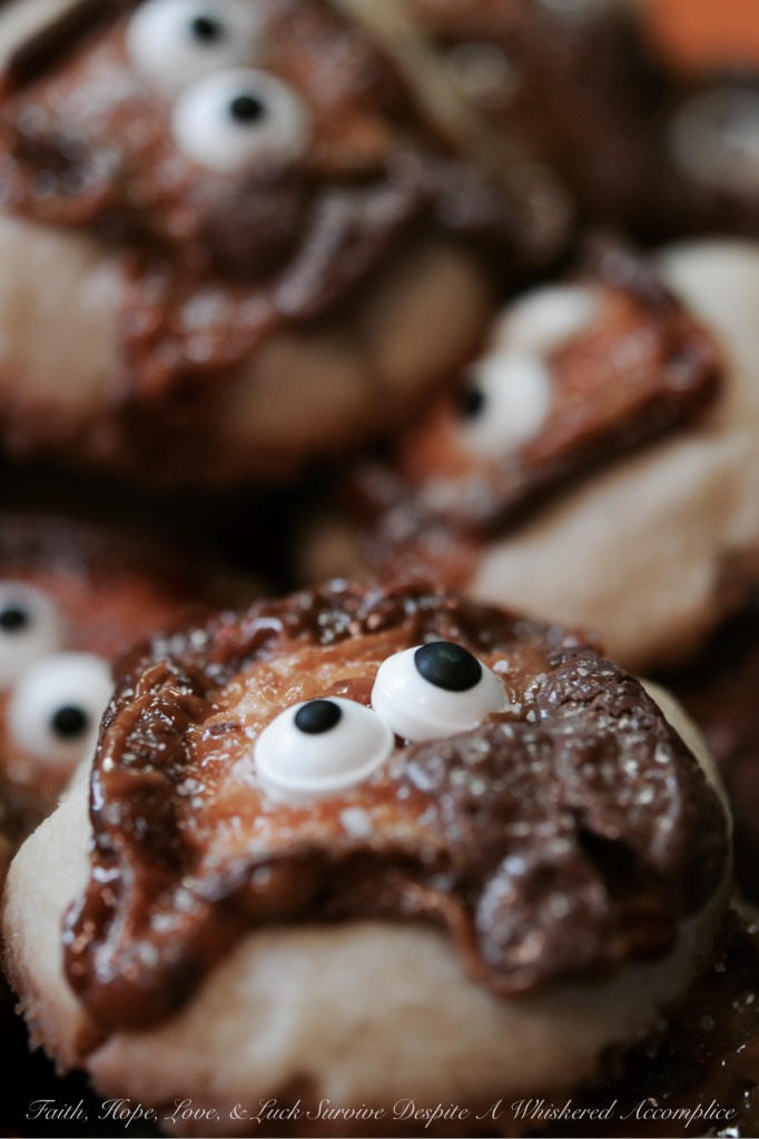 Milky Way Melted Ghost Cookies - These adorable Halloween cookies are so extremely festive, yet so easy to make. Simply place a mini Milky Way candy bar on top of each cookie before baking and then decorate with candy eyes and a light sprinkle of sea salt after taking out of the oven. How simple is that? These cookies are such a fun, festive, and adorably spooky holiday treat.