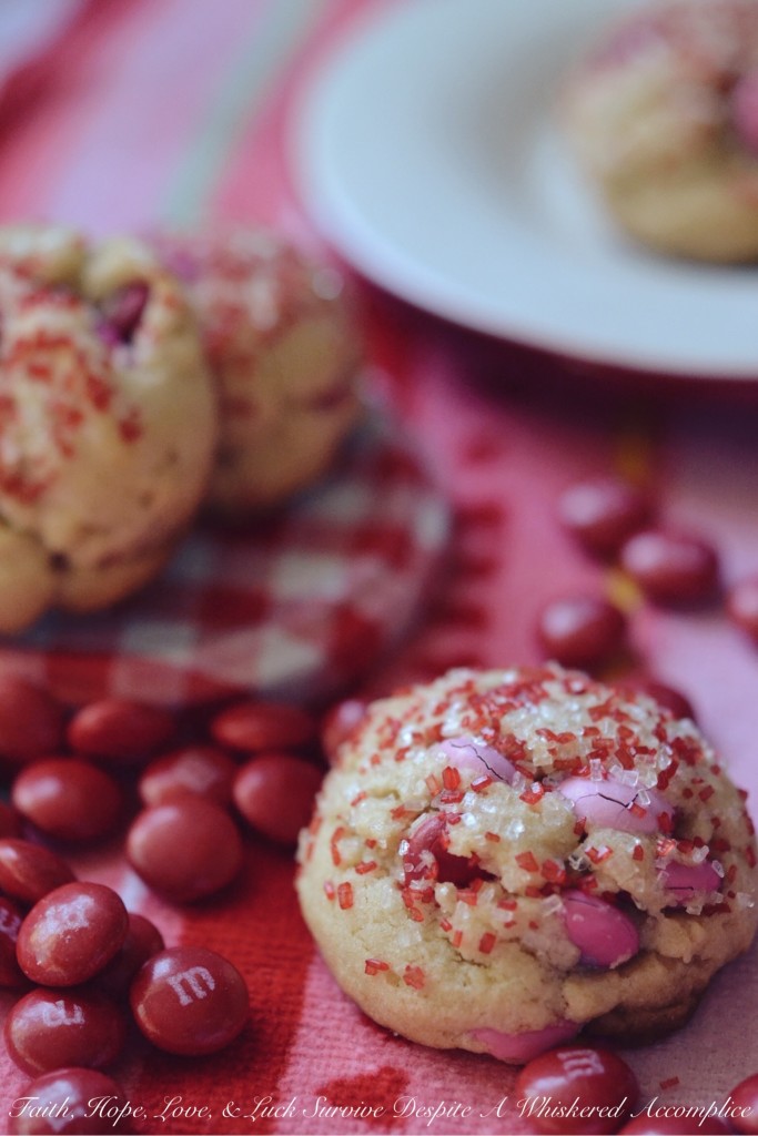 Valentine's Tea Cookies - Celebrate Valentine's Day with these Valentine's Tea Cookies, which are filled with a healthy dose of Milk Chocolate M&M's and generously sprinkled with red and white sanding sugar.