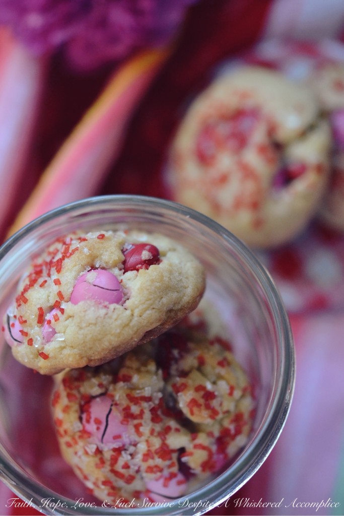 Valentine's Tea Cookies - Celebrate Valentine's Day with these Valentine's Tea Cookies, which are filled with a healthy dose of Milk Chocolate M&M's and generously sprinkled with red and white sanding sugar.