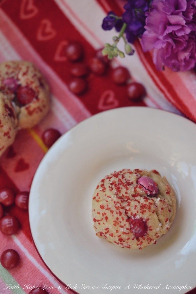 Valentine's Tea Cookies - Celebrate Valentine's Day with these Valentine's Tea Cookies, which are filled with a healthy dose of Milk Chocolate M&M's and generously sprinkled with red and white sanding sugar.