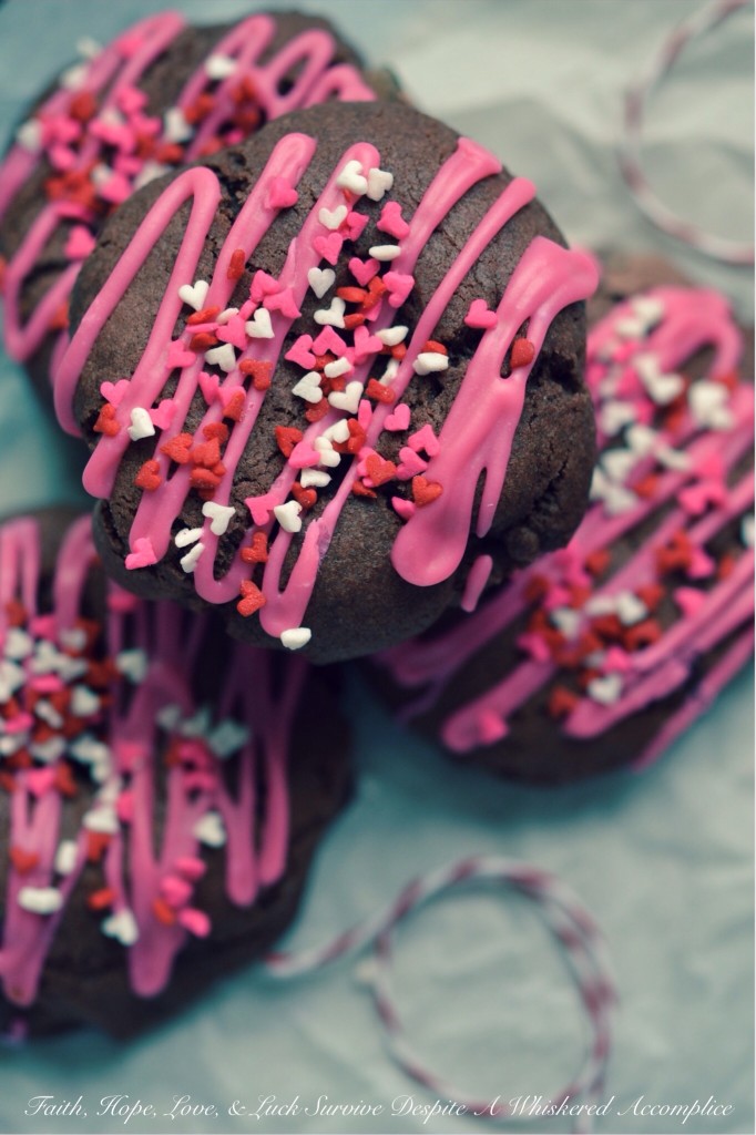 Rose Velvet Chocolate Chip Cookies - Instead of red velvet cookies, these Valentine's Day chocolate chip cookies are rose velvet cookies. They're made using rose icing color, unsweetened cocoa powder, and a generous amount of bittersweet chocolate chips. After being drizzled with rose-colored icing and sprinkled with lots of tiny candy heart sprinkles, these lovely sweet cookies are ready to be given to your special Valentine.