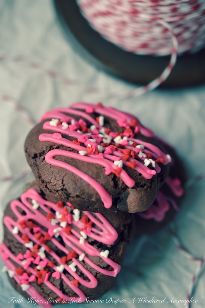 Rose Velvet Chocolate Chip Cookies - Instead of red velvet cookies, these Valentine's Day chocolate chip cookies are rose velvet cookies. They're made using rose icing color, unsweetened cocoa powder, and a generous amount of bittersweet chocolate chips. After being drizzled with rose-colored icing and sprinkled with lots of tiny candy heart sprinkles, these lovely sweet cookies are ready to be given to your special Valentine.