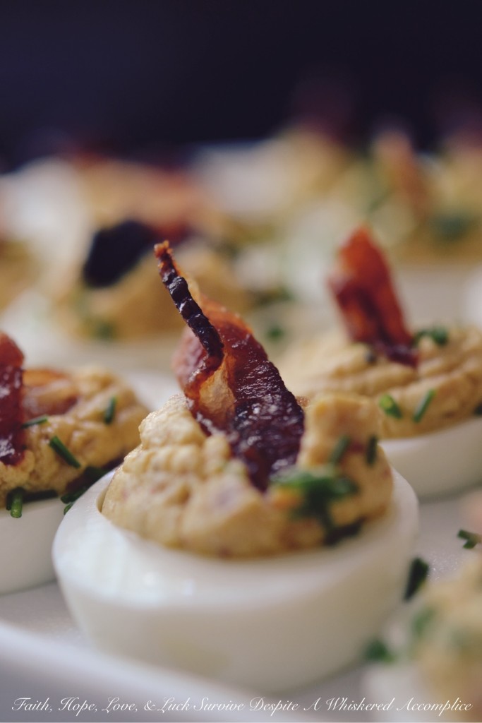 Bourbon Candied Bacon Deviled Eggs - At our house, it doesn’t get any better than deviled eggs with bacon. Bourbon candied bacon, that is. If you can resist these bacon-loaded deviled eggs, then there is most definitely a huge problem because we certainly can't. These are clearly an appetizer that will disappear in the blink of an eye, so to be safe, we suggest doubling the recipe.