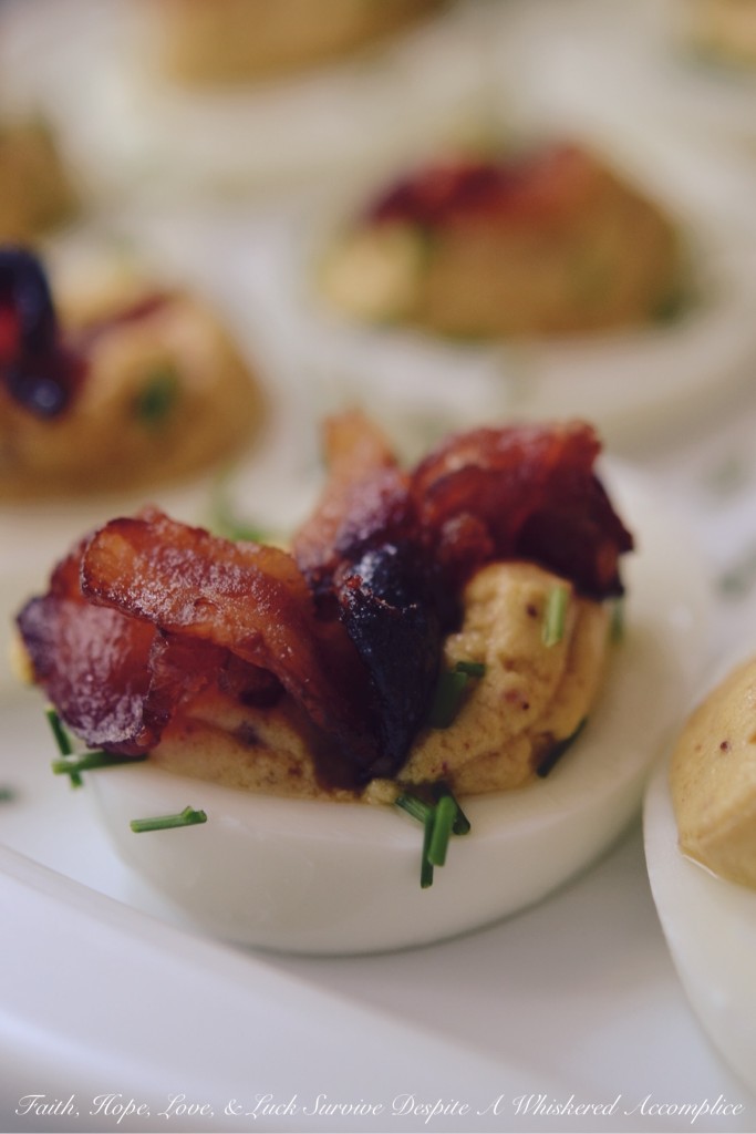 Bourbon Candied Bacon Deviled Eggs - At our house, it doesn’t get any better than deviled eggs with bacon. Bourbon candied bacon, that is. If you can resist these bacon-loaded deviled eggs, then there is most definitely a huge problem because we certainly can't. These are clearly an appetizer that will disappear in the blink of an eye, so to be safe, we suggest doubling the recipe.