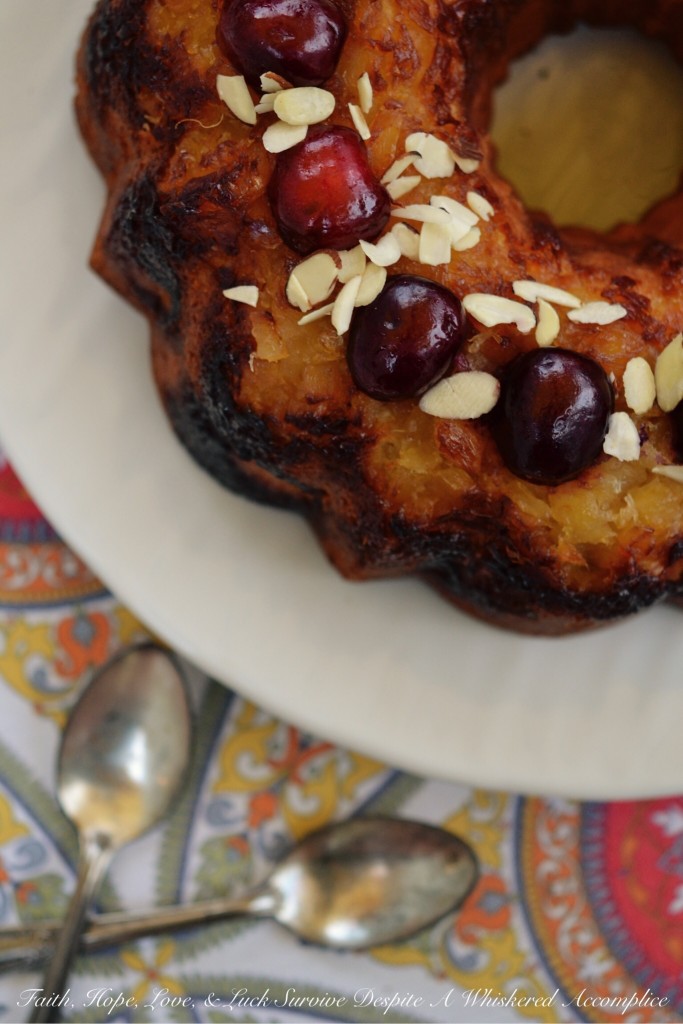 Pineapple Sundae Bundt Cake - This delicious buttery Bundt cake is not your average cake. It's loaded with pineapple and sliced almonds, and the fresh cherries and additional sliced almonds on top make a gorgeous and tasty garnish with lots of texture. Eating a slice of this cake is almost like having an ice cream sundae, minus the ice cream, of course.