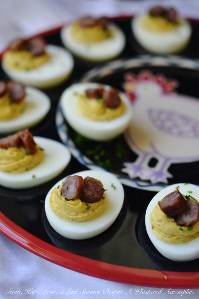 Maple Sausage Breakfast Deviled Eggs - Imagine the creamy, tangy goodness of a classic deviled egg infused with the irresistible taste of maple sausage. Perfectly seasoned with mayonnaise, mustard, black pepper, and a touch of real maple syrup, these utterly delicious deviled eggs are garnished with a festive and flavorful sprinkle of fresh chives as well as a few slices of maple sausage. Whether you're looking for a unique appetizer or a fun addition to your next brunch spread, these delightful breakfast-worthy deviled eggs are guaranteed to be a conversation starter.