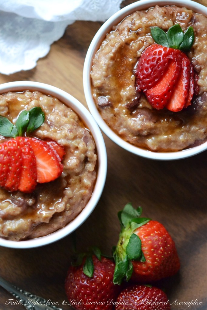 Overnight Crockpot Cinnamon Strawberry Oatmeal - Cozy up this winter, with this sweet strawberry and cinnamon overnight crockpot oatmeal recipe. A few ingredients, fresh strawberries, steel cut oatmeal, and a crockpot or slow-cooker are all you need to make a comforting, warm, and absolutely luscious breakfast that will be waiting for you when you finally decide to roll out of bed in the morning.