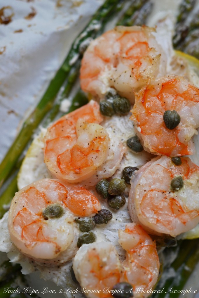 Lemony Mayonnaise Cod, Shrimp, and Asparagus Parchment Paper Wrapped Bundles - Get ready to enjoy a flavorful, flaky, and incredibly convenient meal that will become a new favorite in your dinnertime rotation. Flaky cod and succulent shrimp are baked to tender perfection along with crisp fresh asparagus and thin slices of zesty lemon in parchment paper-wrapped bundles. With their bright and creamy lemony mayonnaise sauce, these delightful fish and seafood bundles are perfect for a quick weeknight meal or a sophisticated weekend dinner.