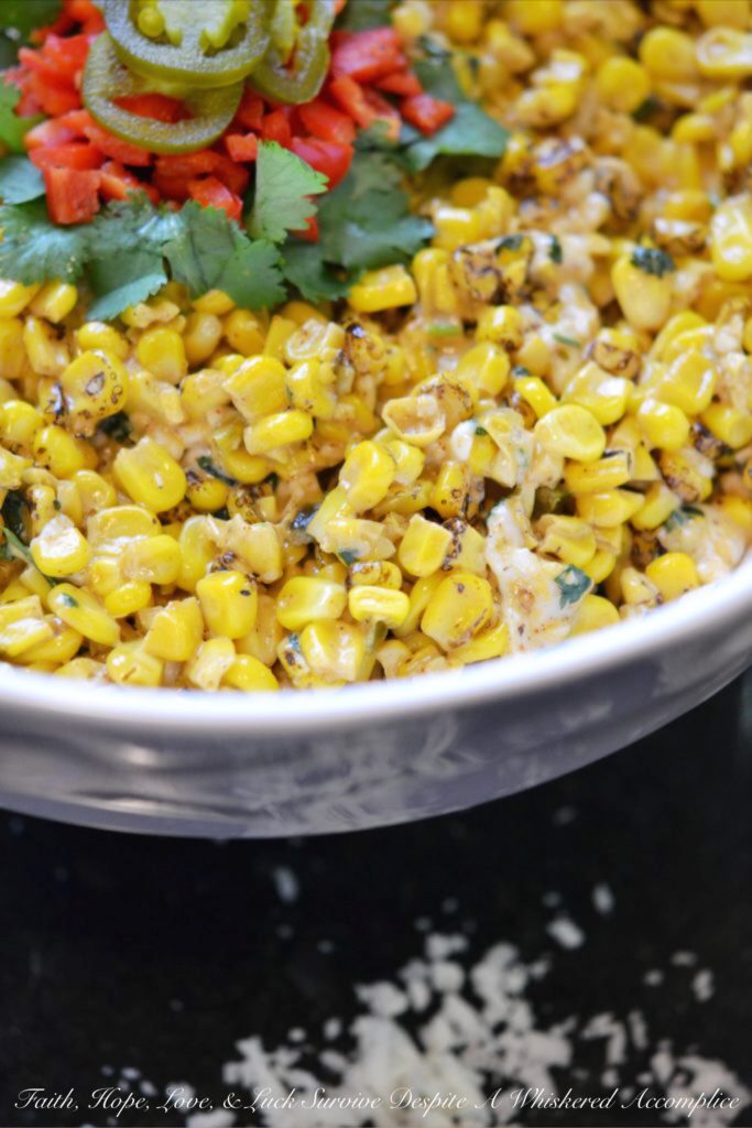 Mexican Street Corn Salad - Looking for a quick and easy Mexican side dish to celebrate Cinco de Mayo? Well then, this is the street corn salad recipe you've been waiting for. Not only is this Mexican Street Corn Salad packed with flavor but it's also a great way to turn frozen corn into a side salad fit for a fiesta.
