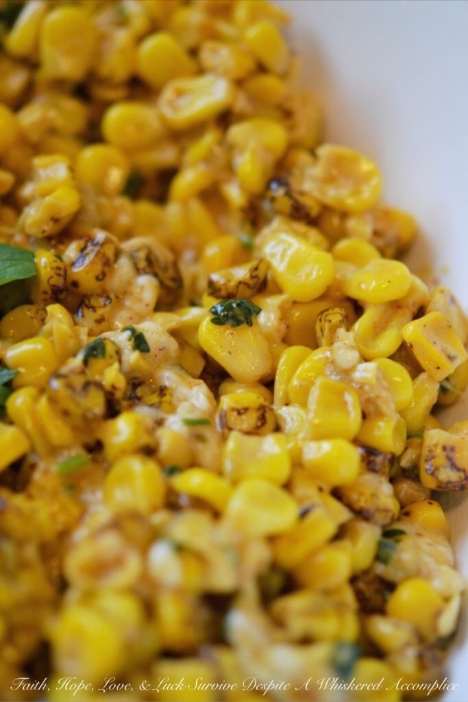 Mexican Street Corn Salad - Looking for a quick and easy Mexican side dish to celebrate Cinco de Mayo? Well then, this is the street corn salad recipe you've been waiting for. Not only is this Mexican Street Corn Salad packed with flavor but it's also a great way to turn frozen corn into a side salad fit for a fiesta.