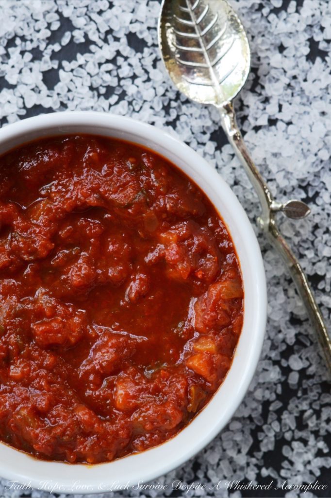 Toss It All In Chunky Crockpot Tomato Sauce - This homemade chunky tomato sauce, simmered in a crockpot, doesn't get any simpler or any more delicious. Unlike some recipes, which require sautéeing the onions and garlic first, this flavorful recipe skips past those steps, making it perfect to throw together on a weekday morning before heading off to work.