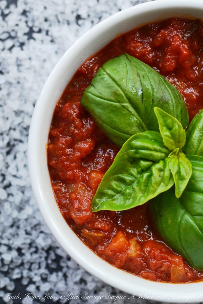 Toss It All In Chunky Crockpot Tomato Sauce - This homemade chunky tomato sauce, simmered in a crockpot, doesn't get any simpler or any more delicious. Unlike some recipes, which require sautéeing the onions and garlic first, this flavorful recipe skips past those steps, making it perfect to throw together on a weekday morning before heading off to work.