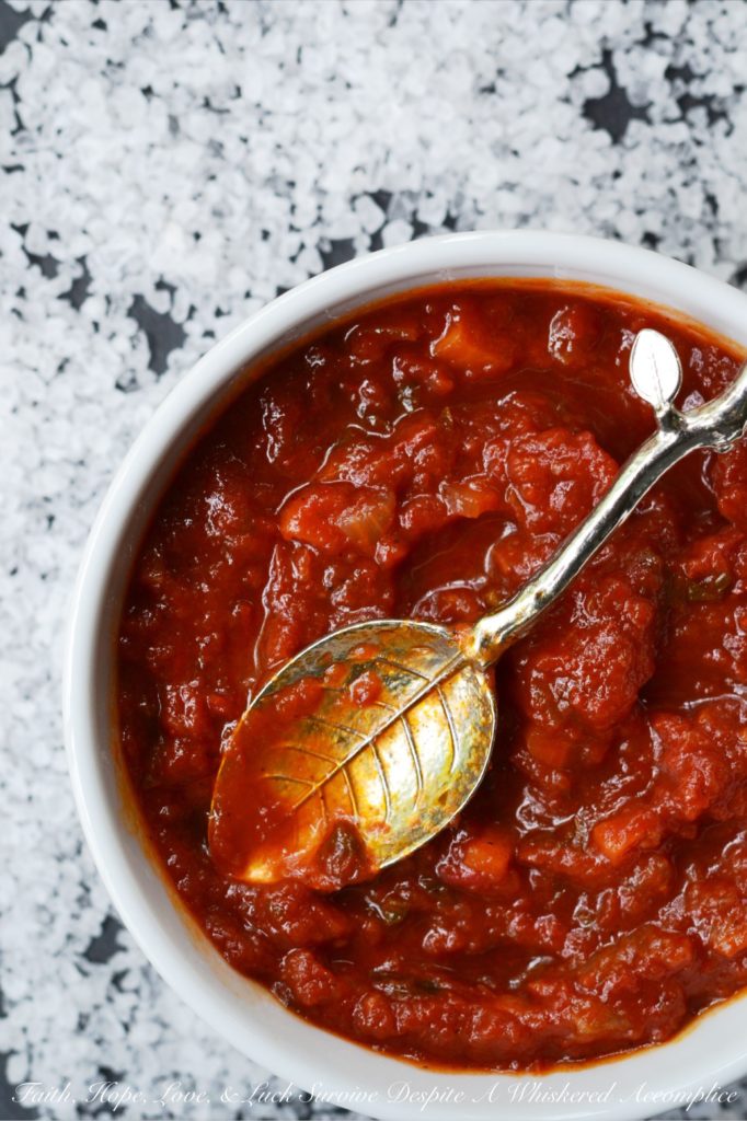 Toss It All In Chunky Crockpot Tomato Sauce - This homemade chunky tomato sauce, simmered in a crockpot, doesn't get any simpler or any more delicious. Unlike some recipes, which require sautéeing the onions and garlic first, this flavorful recipe skips past those steps, making it perfect to throw together on a weekday morning before heading off to work.