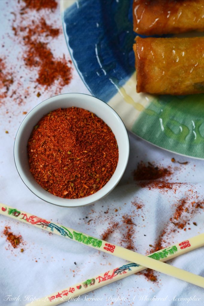 Cajun Shrimp Egg Rolls - Asian meets Cajun in this easy-to-make Cajun Shrimp Egg Roll recipe. Use store-bought spring roll shells, cellophane noodles, and cole slaw mix to make flavorful crunchy egg rolls, with the addition of chopped shrimp and Cajun seasoning. Serve with honey for the perfect sweet and spicy flavor combination.