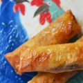 Cajun Shrimp Egg Rolls - Asian meets Cajun in this easy-to-make Cajun Shrimp Egg Roll recipe. Use store-bought spring roll shells, cellophane noodles, and cole slaw mix to make flavorful crunchy egg rolls, with the addition of chopped shrimp and Cajun seasoning. Serve with honey for the perfect sweet and spicy flavor combination.