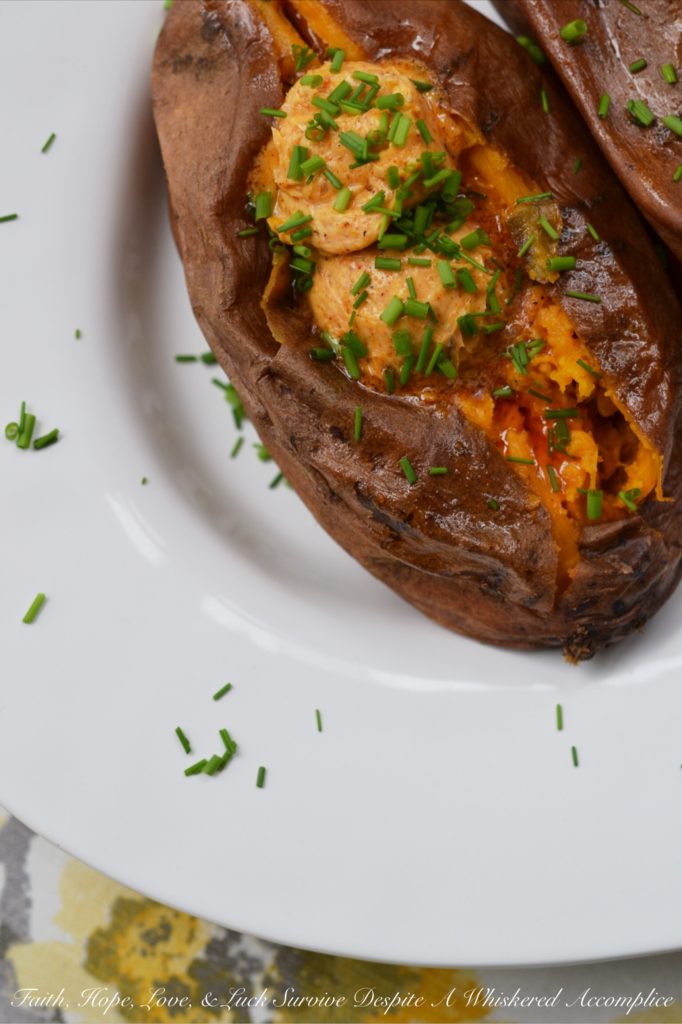 Crockpot Cajun Butter Roasted Sweet Potatoes - Looking for an easy summer BBQ side dish or a low-effort comforting winter Meatless Monday recipe? Look no further than these sweet crockpot roasted sweet potatoes topped with Cajun butter. These slow-cooked sweet potatoes could just easily become your new favorite way to eat sweet potatoes.
