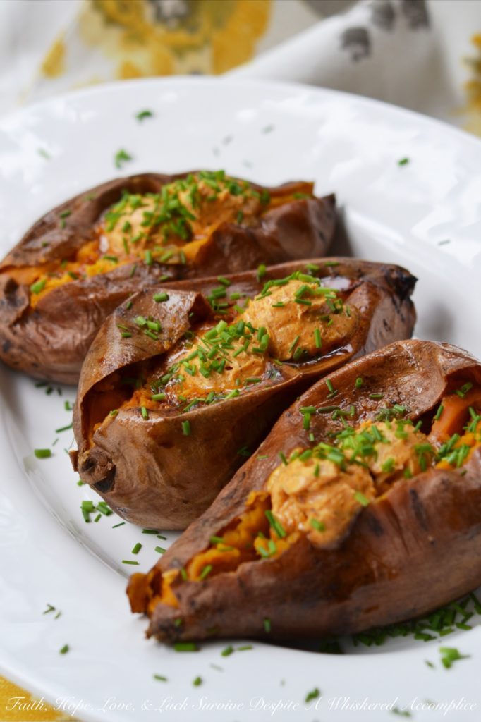 Crockpot Cajun Butter Roasted Sweet Potatoes - Looking for an easy summer BBQ side dish or a low-effort comforting winter Meatless Monday recipe? Look no further than these sweet crockpot roasted sweet potatoes topped with Cajun butter. These slow-cooked sweet potatoes could just easily become your new favorite way to eat sweet potatoes.