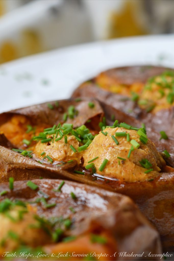 Crockpot Cajun Butter Roasted Sweet Potatoes - Looking for an easy summer BBQ side dish or a low-effort comforting winter Meatless Monday recipe? Look no further than these sweet crockpot roasted sweet potatoes topped with Cajun butter. These slow-cooked sweet potatoes could just easily become your new favorite way to eat sweet potatoes.