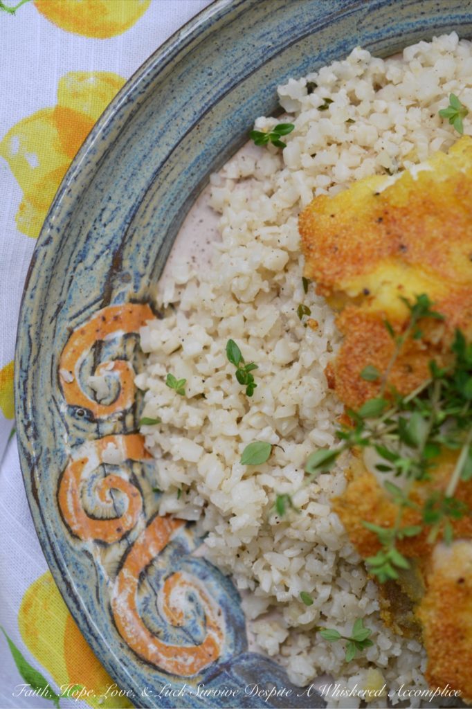 Cornmeal Crusted Cod with Buttermilk Cauliflower Rice - Imagine tender, flaky cod fillets that are pan-fried to a beautiful golden brown with a satisfyingly crispy cornmeal crust. Now picture those fish fillets served on a bed of creamy, tangy cauliflower rice seasoned with buttermilk. Get ready to add a little adventure to your weeknight dinner routine because this is definitely not your ordinary fish and vegetable combination.