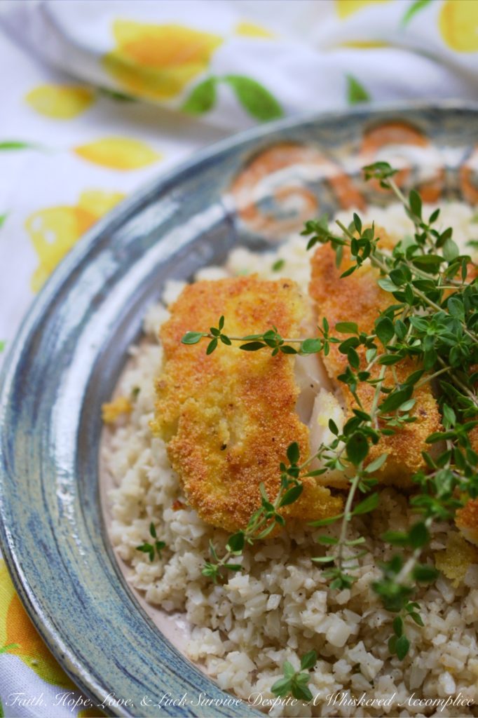 Cornmeal Crusted Cod with Buttermilk Cauliflower Rice - Imagine tender, flaky cod fillets that are pan-fried to a beautiful golden brown with a satisfyingly crispy cornmeal crust. Now picture those fish fillets served on a bed of creamy, tangy cauliflower rice seasoned with buttermilk. Get ready to add a little adventure to your weeknight dinner routine because this is definitely not your ordinary fish and vegetable combination.