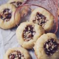 Strawberry Pecan Tea Cookies - These crumbly buttery thumbprint cookies go just as great with your morning coffee as they do with your afternoon tea. They're also just as tasty for dessert or a late-night snack. Filled with strawberry preserves, sprinkled with finely chopped pecans, and then drizzled with a sweet vanilla icing, these are one sweet crunchy tea cookie that you'll instantly swoon over.