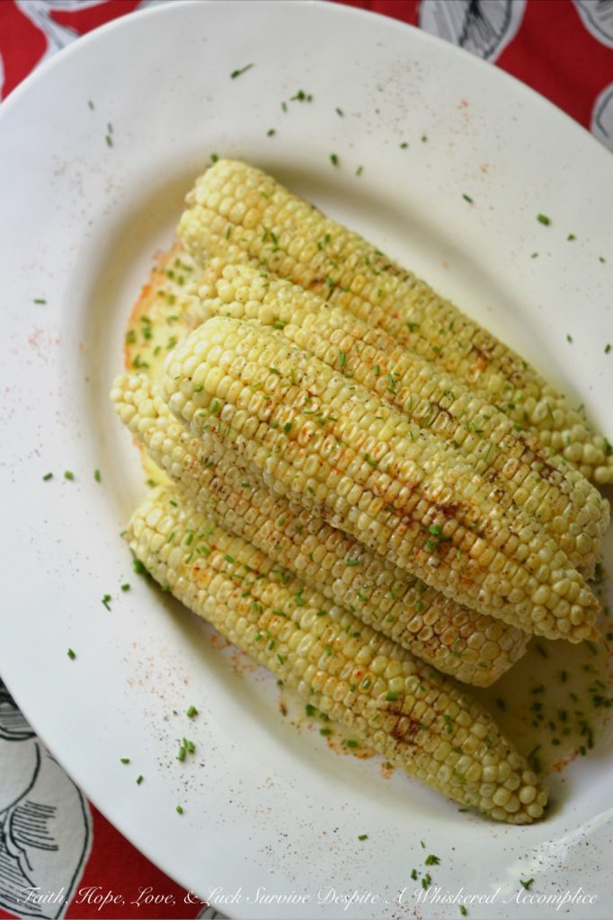 Summer Crockpot Crazy Corn - There's nothing better than summer corn. Oh wait, there is. Summer corn slathered in butter, sprinkled with seasoning, and then steamed for a few hours in a crockpot. Summer has arrived; let's get crazy!