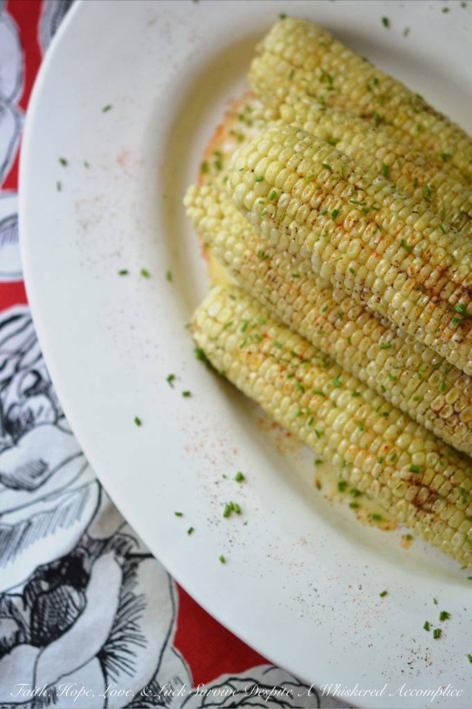 Summer Crockpot Crazy Corn - There's nothing better than summer corn. Oh wait, there is. Summer corn slathered in butter, sprinkled with seasoning, and then steamed for a few hours in a crockpot. Summer has arrived; let's get crazy!