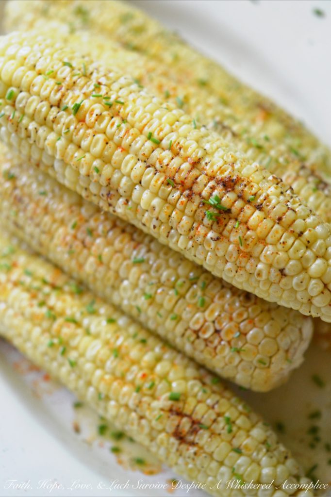 Summer Crockpot Crazy Corn - There's nothing better than summer corn. Oh wait, there is. Summer corn slathered in butter, sprinkled with seasoning, and then steamed for a few hours in a crockpot. Summer has arrived; let's get crazy!