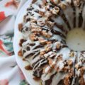 Jewish Praline Pecan Apple Cake - This apple-studded cake is the perfect Autumn Bundt. Topped with crunchy cinnamon praline pecans and drizzled with powdered sugar glaze, it's cake at its very best.
