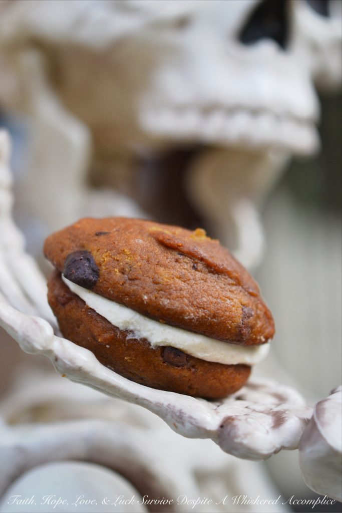 Pumpkin Chocolate Whoopie Cookies - Treat your little ghouls and goblins to these delicious pumpkin and chocolate cream cheese-filled whoopie pie cookies this Halloween season.