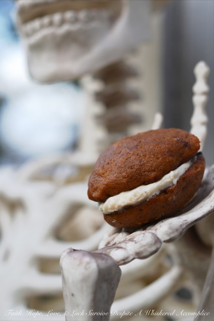 Pumpkin Chocolate Whoopie Cookies - Treat your little ghouls and goblins to these delicious pumpkin and chocolate cream cheese-filled whoopie pie cookies this Halloween season.