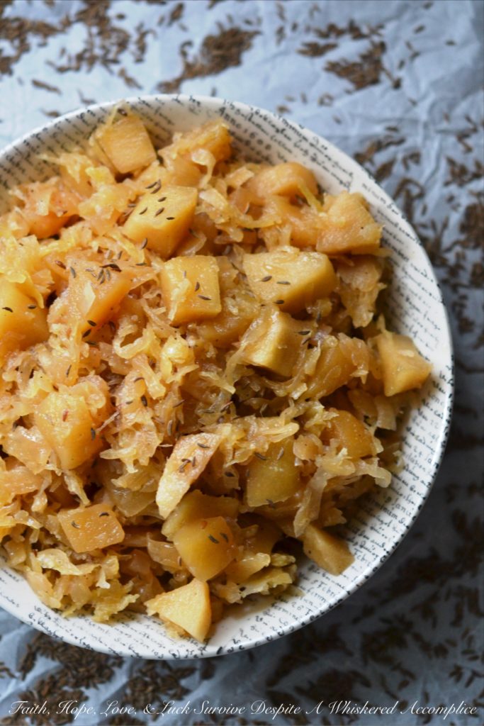 Autumn Crockpot Apple Sauerkraut - Give your crockpot sauerkraut the taste of autumn with the addition of seasonal apples, brown sugar, Oktoberfest beer, diced onion, and caraway seeds.
