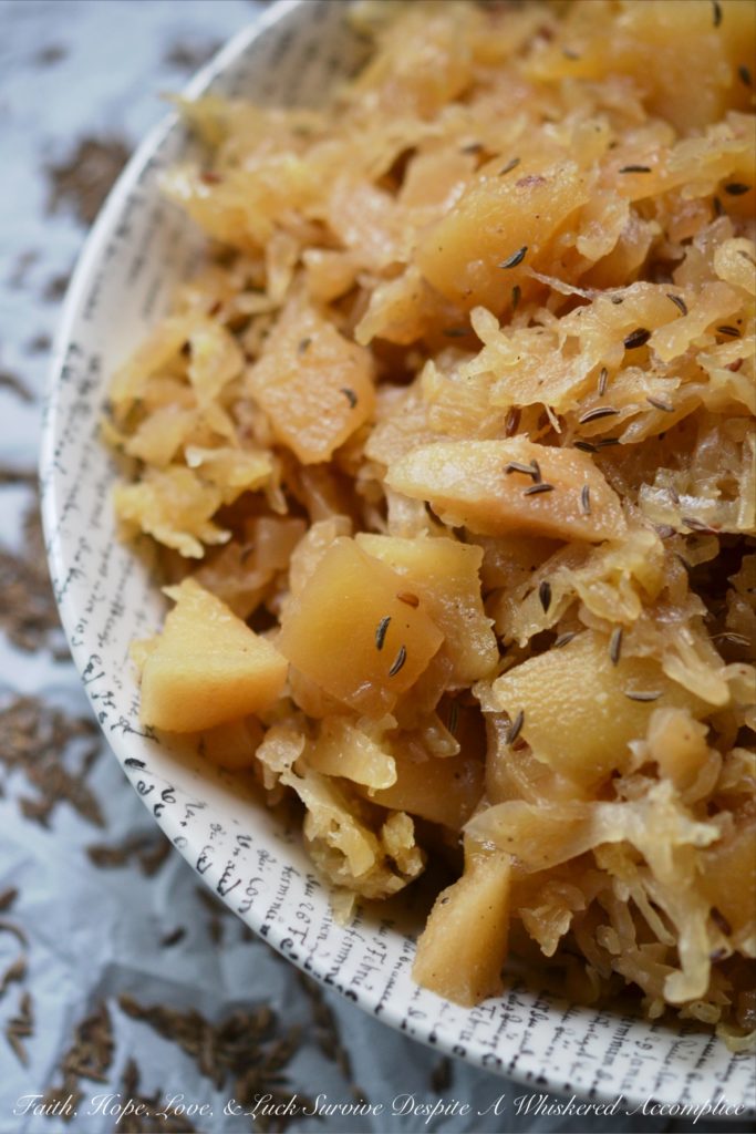 Autumn Crockpot Apple Sauerkraut - Give your crockpot sauerkraut the taste of autumn with the addition of seasonal apples, brown sugar, Oktoberfest beer, diced onion, and caraway seeds.