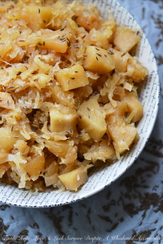 Autumn Crockpot Apple Sauerkraut - Give your crockpot sauerkraut the taste of autumn with the addition of seasonal apples, brown sugar, Oktoberfest beer, diced onion, and caraway seeds.