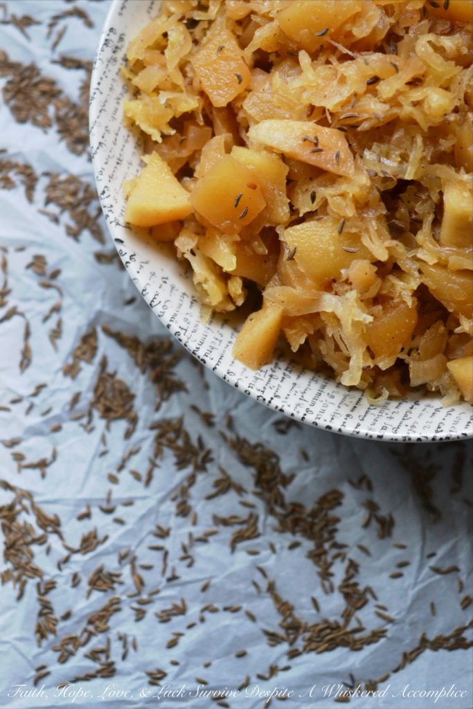 Autumn Crockpot Apple Sauerkraut - Give your crockpot sauerkraut the taste of autumn with the addition of seasonal apples, brown sugar, Oktoberfest beer, diced onion, and caraway seeds.