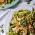 Pepita Pesto-Coated Pasta with Shrimp - Looking for a vibrant and flavorful pasta dish with pesto and seafood that's both satisfying and safe for those with nut allergies? This recipe swaps out traditional pine nuts with salted roasted pepitas, also known as pumpkin seeds, creating a nutty and rich pesto that's safe for those who suffer severe nut allergies. Not only is this Pepita Pesto-Coated Pasta with Shrimp nut allergy-friendly, but it's also surprisingly easy to make, making it a perfect weeknight meal that's sure to impress.