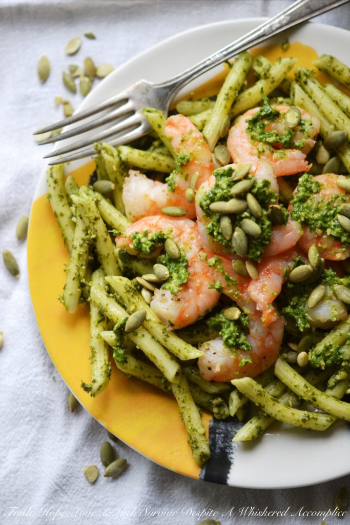Pepita Pesto-Coated Pasta with Shrimp - Looking for a vibrant and flavorful pasta dish with pesto and seafood that's both satisfying and safe for those with nut allergies? This recipe swaps out traditional pine nuts with salted roasted pepitas, also known as pumpkin seeds, creating a nutty and rich pesto that's safe for those who suffer severe nut allergies. Not only is this Pepita Pesto-Coated Pasta with Shrimp nut allergy-friendly, but it's also surprisingly easy to make, making it a perfect weeknight meal that's sure to impress.