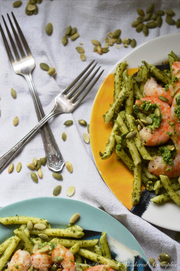 Pepita Pesto-Coated Pasta with Shrimp - Looking for a vibrant and flavorful pasta dish with pesto and seafood that's both satisfying and safe for those with nut allergies? This recipe swaps out traditional pine nuts with salted roasted pepitas, also known as pumpkin seeds, creating a nutty and rich pesto that's safe for those who suffer severe nut allergies. Not only is this Pepita Pesto-Coated Pasta with Shrimp nut allergy-friendly, but it's also surprisingly easy to make, making it a perfect weeknight meal that's sure to impress.