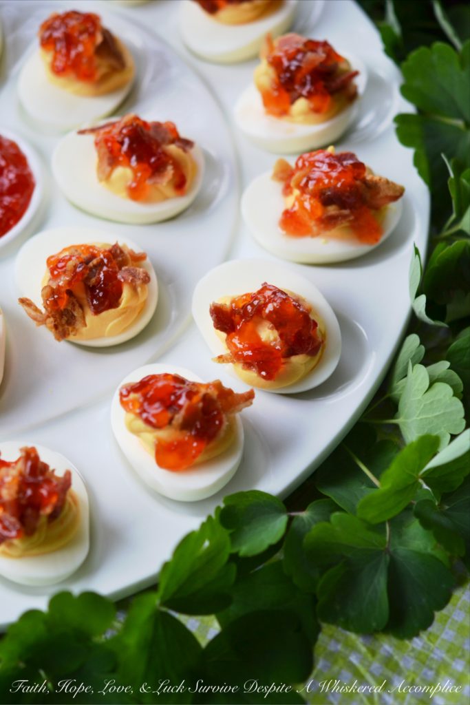 Southern Red Pepper Jelly Deviled Eggs - If you're looking for a holiday appetizer that your guests will swoon over, this is it. The combination of red pepper jelly, cream cheese, and bacon in these deviled eggs will certainly leave a winning impression. And honestly, we wouldn’t blame you one bit if you decided not to wait for a special holiday to whip up a batch.