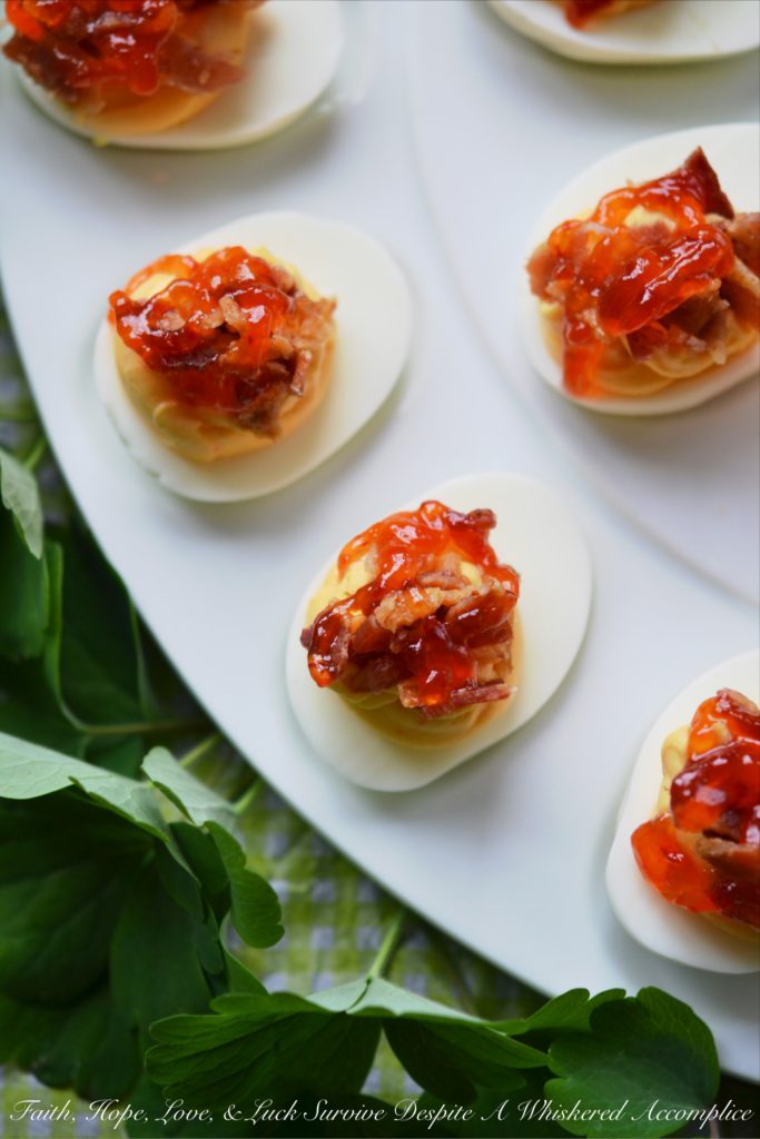 Southern Red Pepper Jelly Deviled Eggs - If you're looking for a holiday appetizer that your guests will swoon over, this is it. The combination of red pepper jelly, cream cheese, and bacon in these deviled eggs will certainly leave a winning impression. And honestly, we wouldn’t blame you one bit if you decided not to wait for a special holiday to whip up a batch.