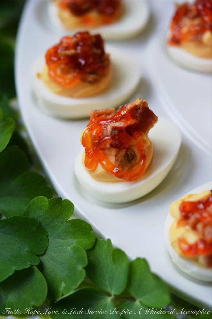 Southern Red Pepper Jelly Deviled Eggs - If you're looking for a holiday appetizer that your guests will swoon over, this is it. The combination of red pepper jelly, cream cheese, and bacon in these deviled eggs will certainly leave a winning impression. And honestly, we wouldn’t blame you one bit if you decided not to wait for a special holiday to whip up a batch.