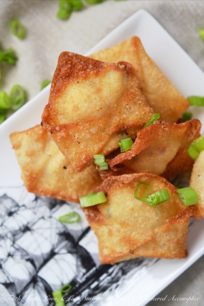 Southern Crab Rangoon - Southern Crab Rangoon truly is the perfect party appetizer, no matter what time of year it is. The secret to their great Southern flavor is a little bit of sweet and spicy pepper jelly added to their filing. And, after you dip these delicious little fried packages of cream cheese and crab meat into a sweet and flavorful boozy pepper jelly dipping sauce, you'll definitely become an instant fan.