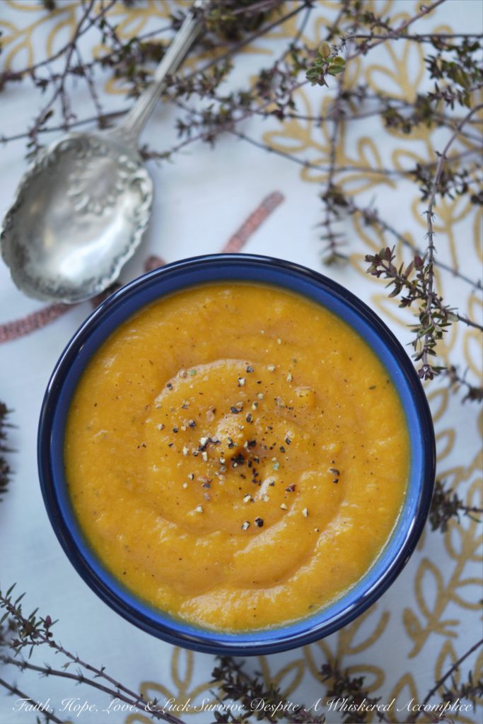 Cozy Winter Sweet Potato & Thyme Soup - This healthy winter soup recipe will leave you feeling cozy and satisfied, no matter how cold the weather is. And, as an added bonus, this creamy soup can be made differently each time with add-ons like cheese, sour cream, chives, bacon, or pumpkin seeds, which means that you can enjoy this soup for several days in a row without ever having to have it the same way twice.