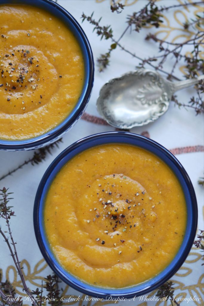 Cozy Winter Sweet Potato & Thyme Soup - This healthy winter soup recipe will leave you feeling cozy and satisfied, no matter how cold the weather is. And, as an added bonus, this creamy soup can be made differently each time with add-ons like cheese, sour cream, chives, bacon, or pumpkin seeds, which means that you can enjoy this soup for several days in a row without ever having to have it the same way twice.