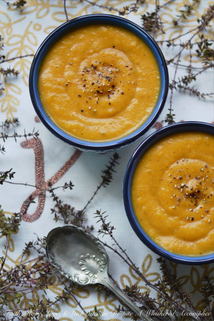 Cozy Winter Sweet Potato & Thyme Soup - This healthy winter soup recipe will leave you feeling cozy and satisfied, no matter how cold the weather is. And, as an added bonus, this creamy soup can be made differently each time with add-ons like cheese, sour cream, chives, bacon, or pumpkin seeds, which means that you can enjoy this soup for several days in a row without ever having to have it the same way twice.