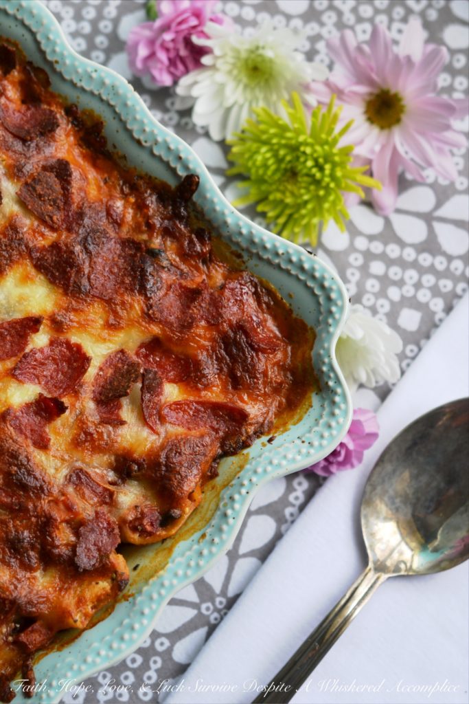 Spinach and Four-Cheese Stuffed Shells - This spinach and four-cheese stuffed shells Italian pasta dish is the perfect recipe to serve for a large family dinner, especially if you're trying to get your family to eat more spinach. After all, it's pretty hard to resist a baked pasta dish, topped with perfectly browned ooey-gooey cheese and crisp pepperoni.