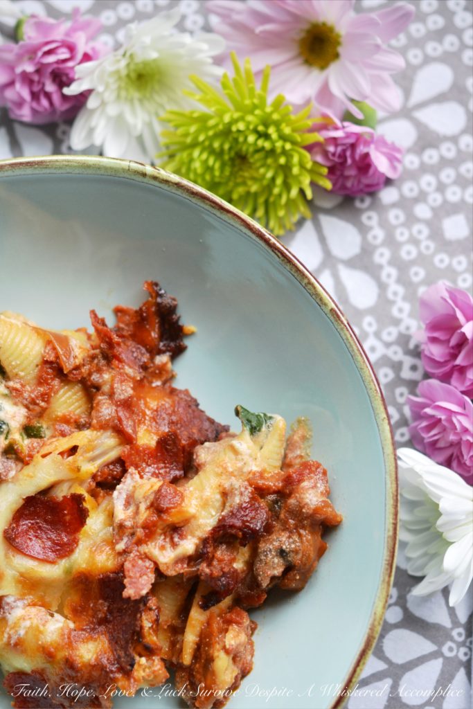 Spinach and Four-Cheese Stuffed Shells - This spinach and four-cheese stuffed shells Italian pasta dish is the perfect recipe to serve for a large family dinner, especially if you're trying to get your family to eat more spinach. After all, it's pretty hard to resist a baked pasta dish, topped with perfectly browned ooey-gooey cheese and crisp pepperoni.