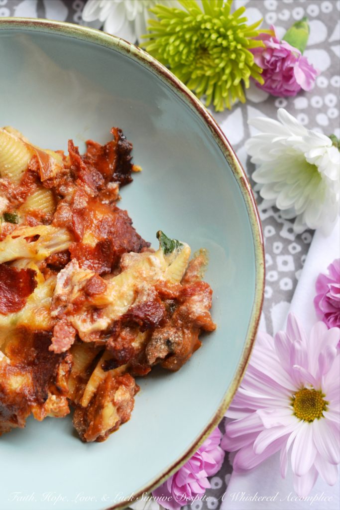 Spinach and Four-Cheese Stuffed Shells - This spinach and four-cheese stuffed shells Italian pasta dish is the perfect recipe to serve for a large family dinner, especially if you're trying to get your family to eat more spinach. After all, it's pretty hard to resist a baked pasta dish, topped with perfectly browned ooey-gooey cheese and crisp pepperoni.