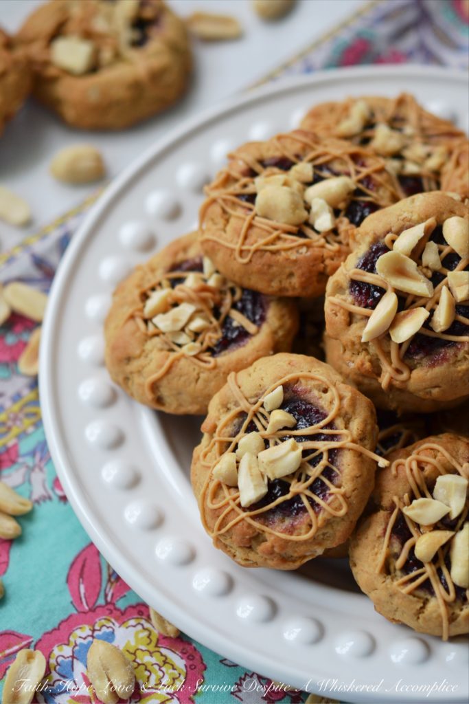 PB&J Banana Oatmeal Thumbprint Cookies - These flavorful thumbprint PB&J cookies are an instant favorite. Serve them for breakfast, as a snack, or even for dessert. With a perfect combination of crunchy, chewy, sweet, and salty, these peanut butter and jelly banana oatmeal thumbprint cookies are sure to be a hit with the whole family.