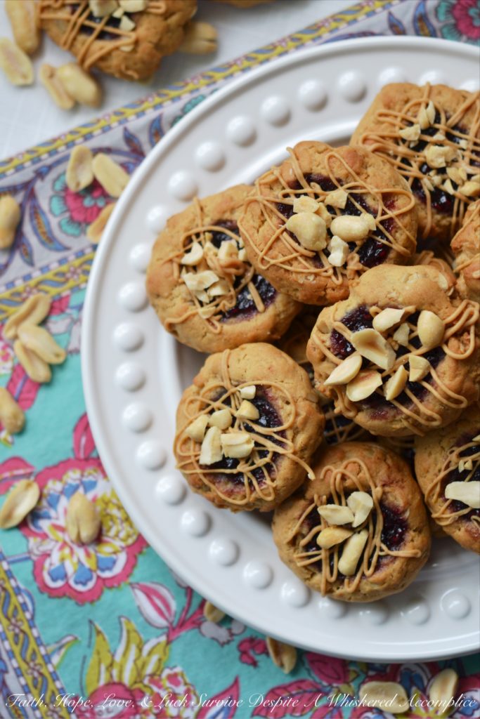 PB&J Banana Oatmeal Thumbprint Cookies - These flavorful thumbprint PB&J cookies are an instant favorite. Serve them for breakfast, as a snack, or even for dessert. With a perfect combination of crunchy, chewy, sweet, and salty, these peanut butter and jelly banana oatmeal thumbprint cookies are sure to be a hit with the whole family.